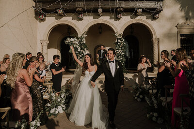 candles and white flowers on wedding tables