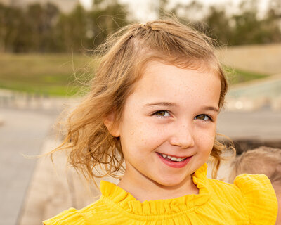 young girl in yellow dress