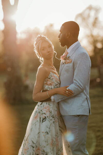 Bride and groom posing in golden hour light in Bucks County PA