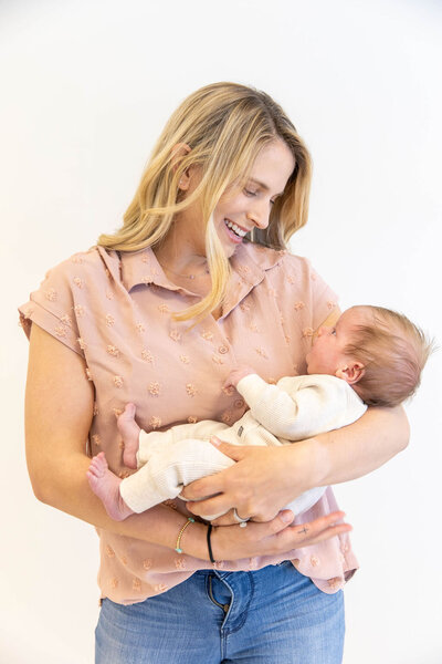 Woman smiling down at her baby