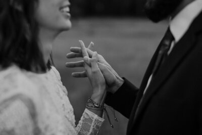 Bride and groom hold hands in Yosemite