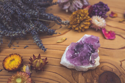 a pink fluorite crystal photographed for online crystal shop with dried blooms