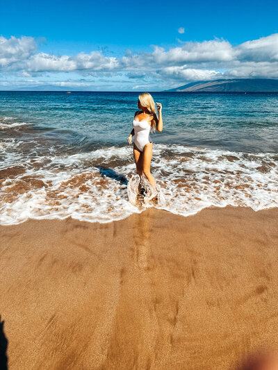 Woman In Swimsuit behind FAQs for the SELF Made System