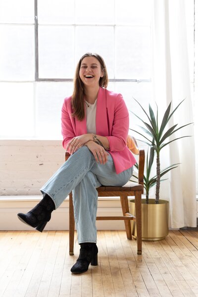 Female web designer and founder, Kate, welcoming female coaches and creatives to her website design business