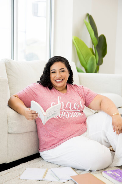 holding-a-book-on-sofa
