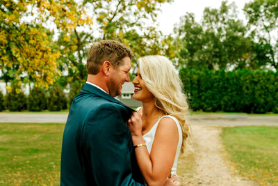 married couple looking at each other and smiling in northern Minnesota