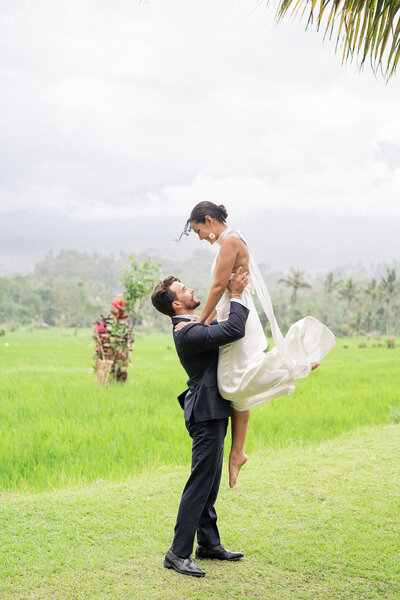 bride holding dress in Bali during wedding photography service