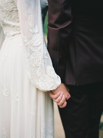 Close up of the bride and groom holding hands at outdoor wedding venue in Baltimore