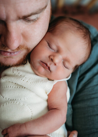 photo of dad holding baby