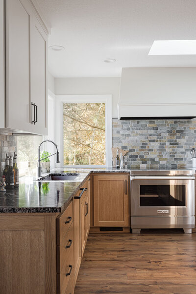 Modern kitchen home remodel with large kitchen island and wooden stools