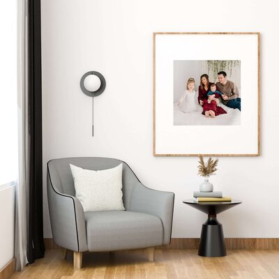 Springfield MO family photographer captured framed family photo in baby nursery
