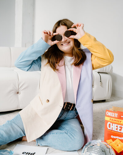 body image coach poses with oreos