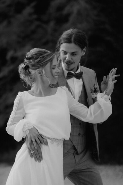 Black and white wedding photography of dancing couple in Spain.