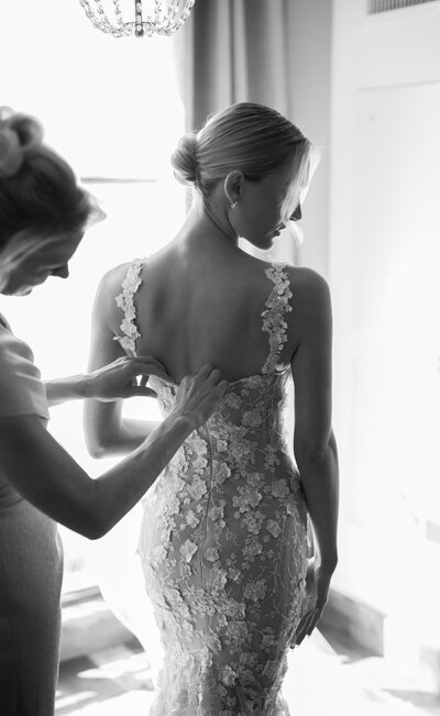 Bride in a gown by Galia Lahav covered in lace