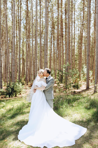 bride and groom hugging at pinewood weddings and events