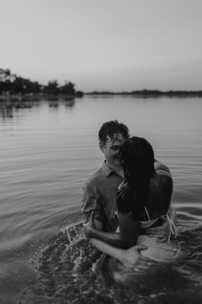 couple swims in lake