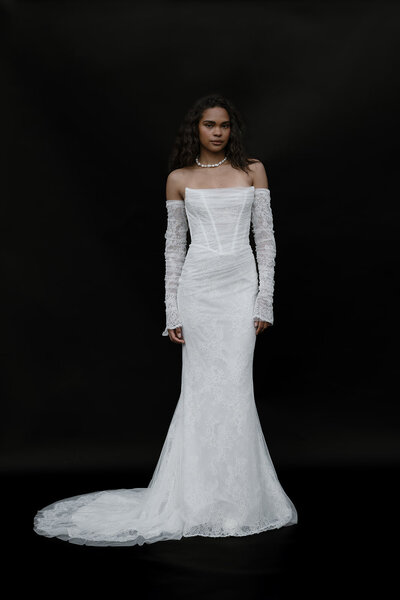 black and white image bride wearing  long sleeve lace wedding dress