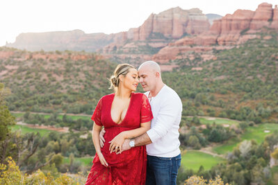 expecting parents embracing each other in Sedona maternity session