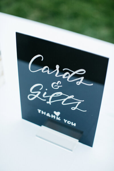 Black acrylic cards and gifts sign with calligraphy by Nob Hill Jane
