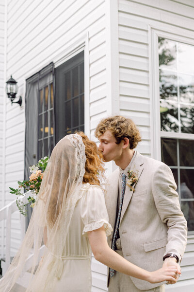 Bride and groom pose looking at the camera for Virginia film wedding photography experience with their photographer.