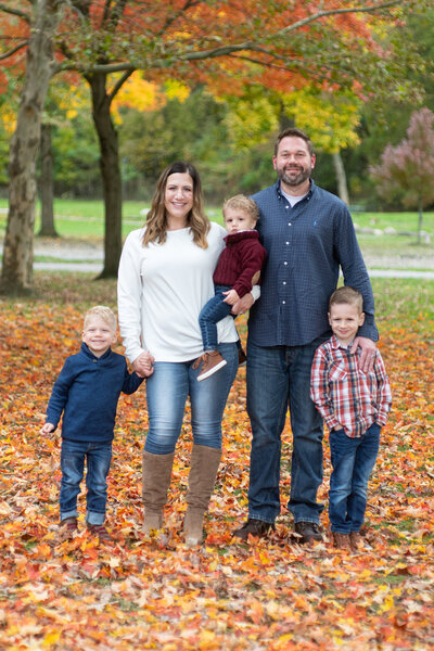 Happy family in fall l eaves
