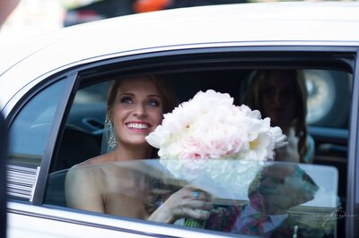 Bride in limo before wedding  with Reflection of Dad