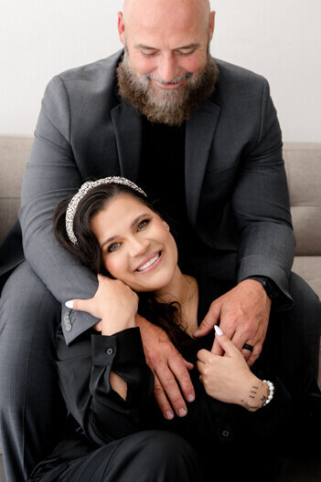 husband and wife Cleveland wedding photographers holding hands