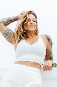 Headshot of Pixie in white shirt and leggings