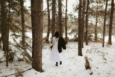 bride walking in forest