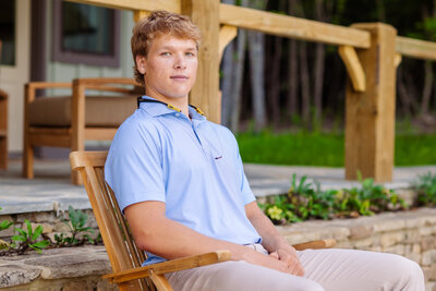 a high school lacrosse player poses for his signal mountain senior photos