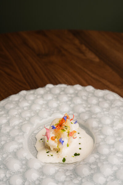 Artfully presented farm-to-table dish highlighting local Niagara ingredients at Revé