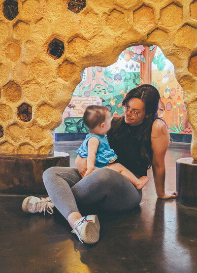Jeannine, a playworker at Brave Nature School, engaging children in sensory play and fostering creativity through nature-based experiences.