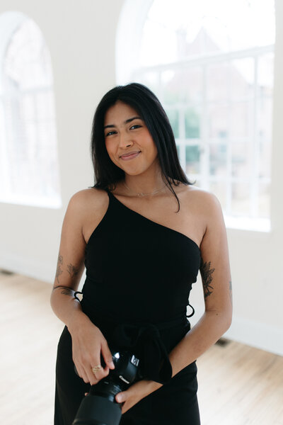 headshot of a Lancaster & Philly Wedding Photographer. Taken with a classy background 