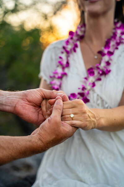 Couple showing off engagement ring after a surprise proposal, by Big Island Hawaii engagement photographer