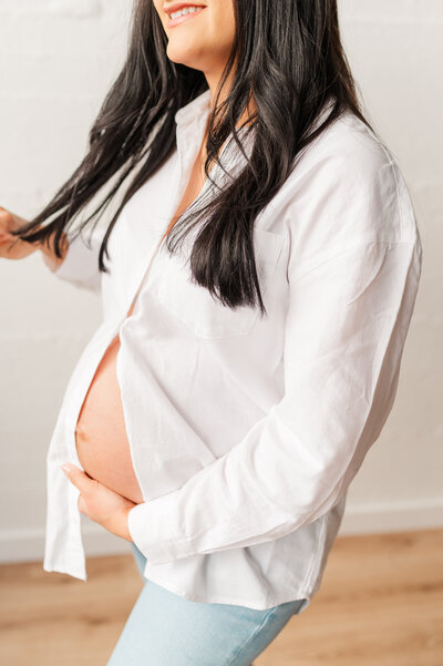 an expecting mama posed for an in studio maternity session with a neutral theme in the lewiston idaho area