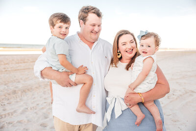 Children playing at the shoreline during family session in Central Florida