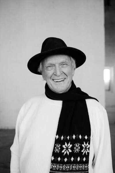 An older male KDS patient smiles at the camera while showing his  new upgraded smile.