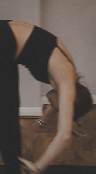 Client doing yoga poses to enhance flexibility and joint health as part of holistic recovery