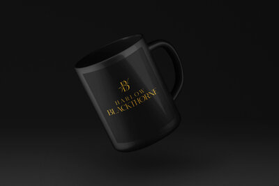 Black mug with gold business logo for author