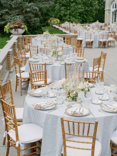 tables and chairs decorated for a wedding reception