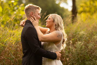 Groom and bride look into each others eyes at Valley of the Eagles in Northeast Ohio. Photographed by Aaron Aldhizer