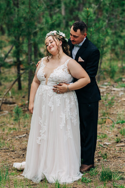 Boulder Wedding Photographer captures groom touching bride's waist