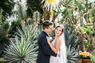 Bride and Groom Take Wedding Portraits in Phipps Conservatory Garden Room