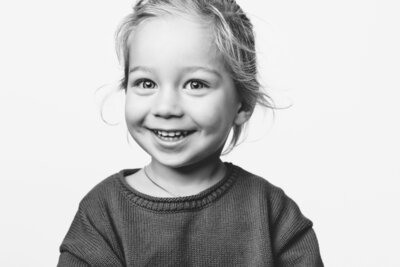Side angle of happy boy looking at St. Petersburg photographer