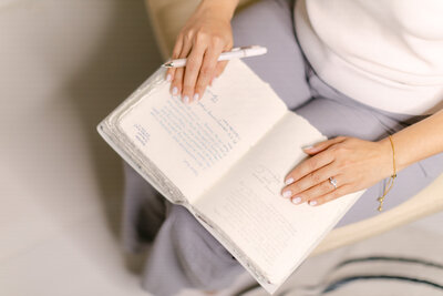 Merlyn Asencio writing in her journal, symbolizing introspection, healing, and the compassionate approach to trauma therapy she offers to clients in Miami.