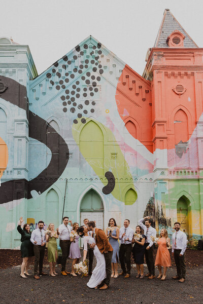 Wedding Party poses in front of Culture House wedding venue in DC