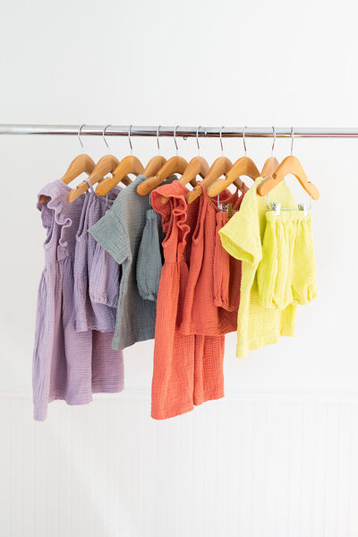 Product photo of kids clothing  on hangers