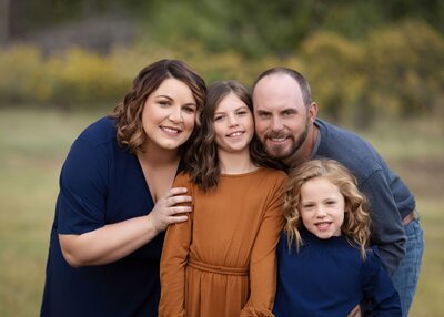 family standing in a field