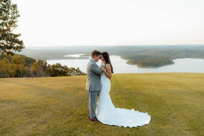 stunning bridal portraits at arkansas venue with bride and groom looking at each other