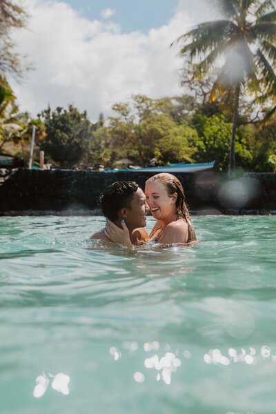 couple kissing in a pool